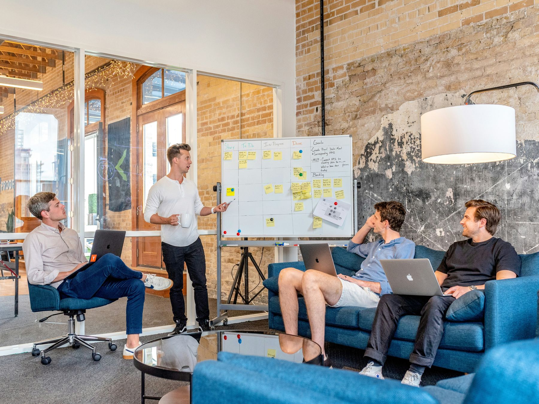 Team collaborating around a table in a bright studio